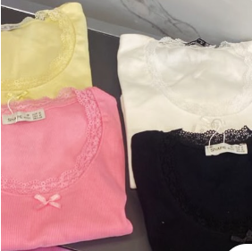 Folded knit tops in yellow, white and black