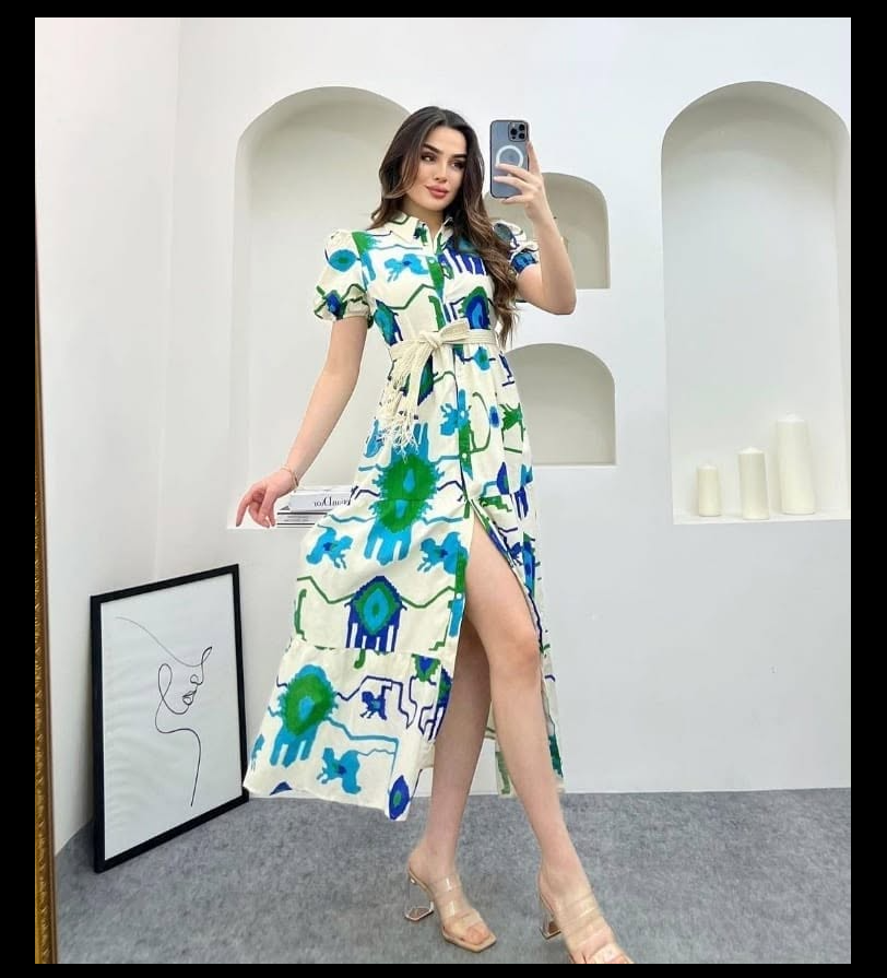 Model wearing a blue and green print midi dress from IN Touch